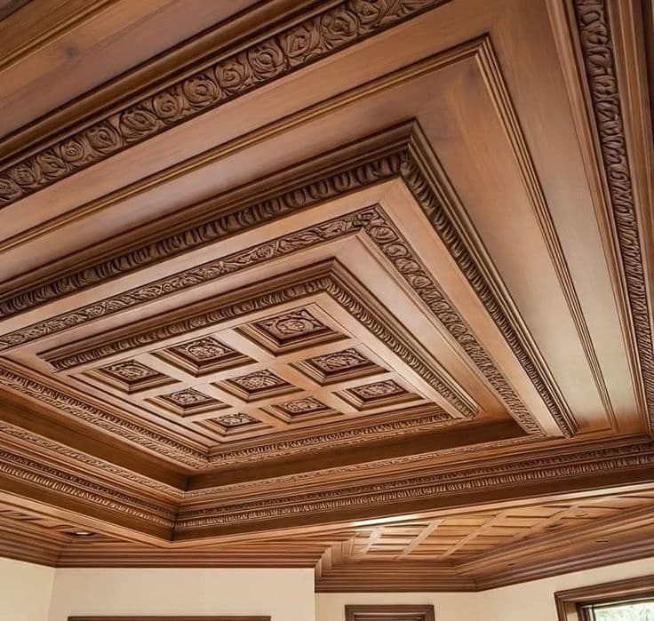 Carved multi-tier wooden ceiling with floral rosettes
