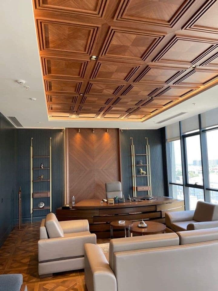 Modern study with chevron wall and coffered wood ceiling