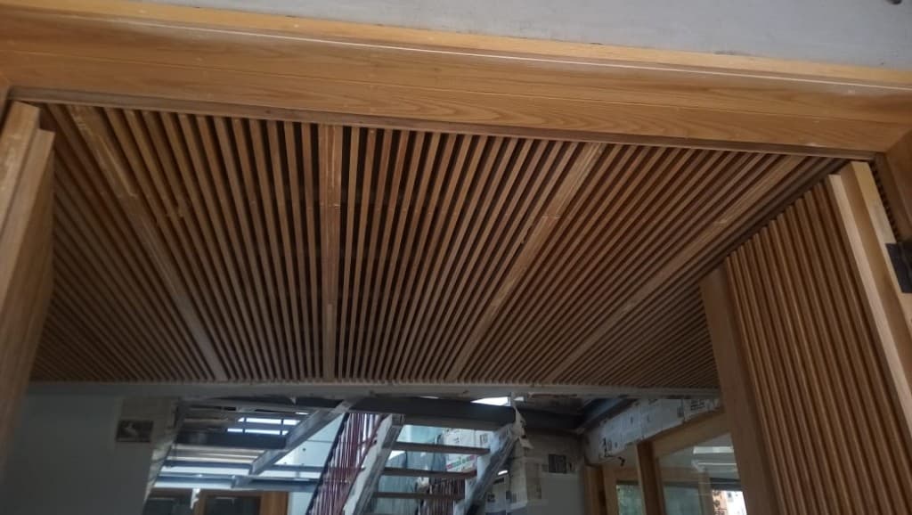 Classic library with LED-lit coffered wooden ceiling