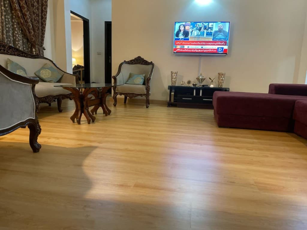 Living room with light honey wooden floor planks