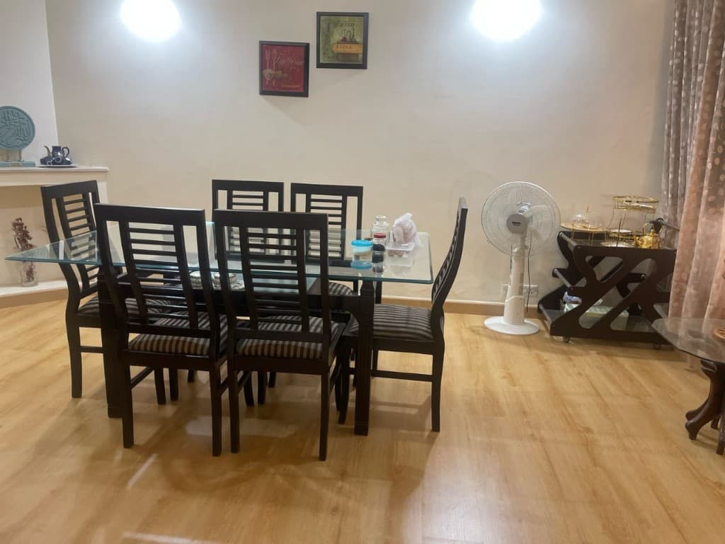 Dining room with light brown wooden plank flooring