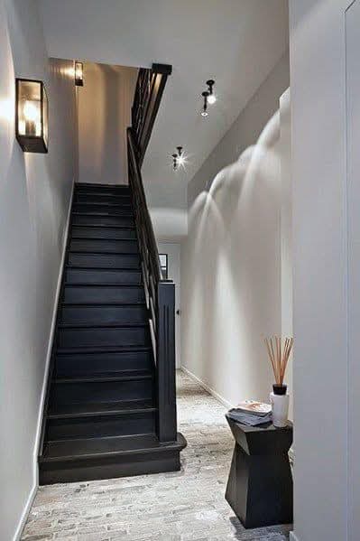 Matte black modern staircase in a bright hallway