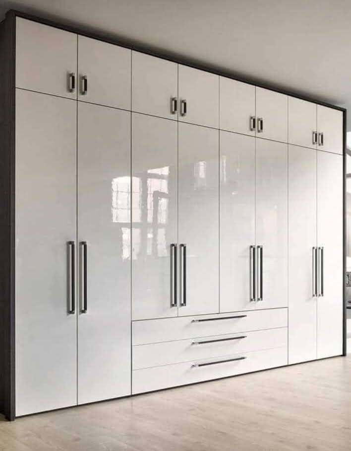 Fitted wooden wardrobe with storage compartments